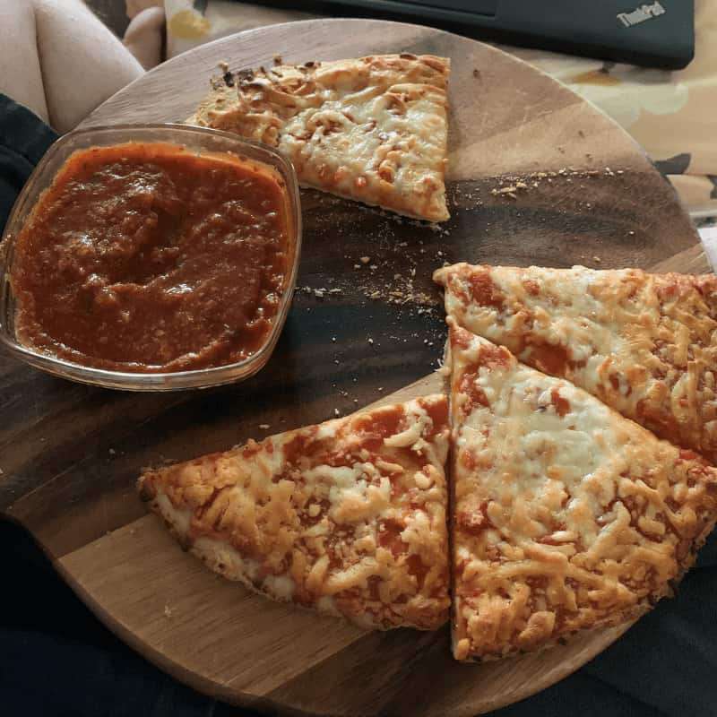 Tony's pizza cooked according to box with side of marinara